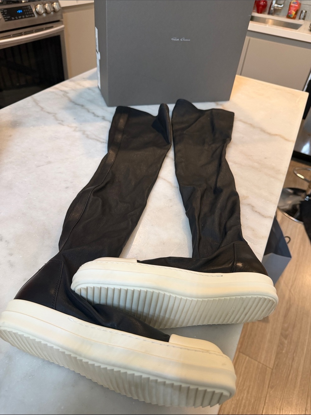 Rick Owens black knee-high boots with white platform sole